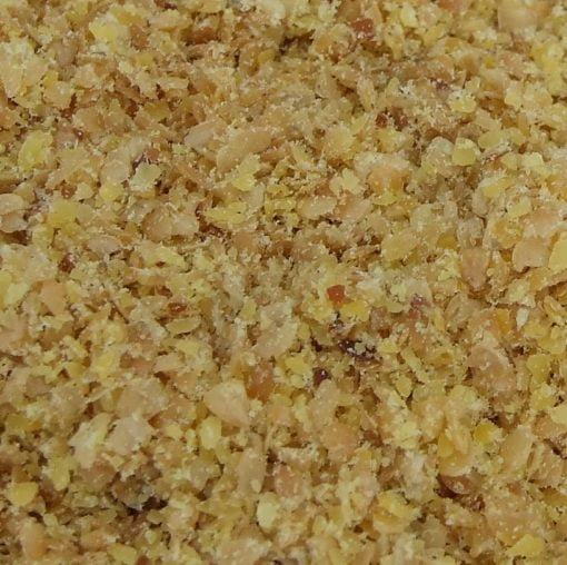Ground golden linseed close-up