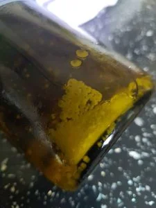 Naturally occurring cloudiness and particles in cold-pressed flax seed linseed oil